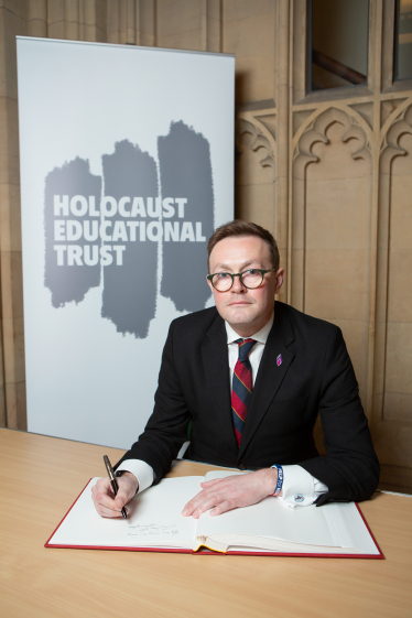 Chris Clarkson MP signing Holocaust Memorial Day Book of Commitment